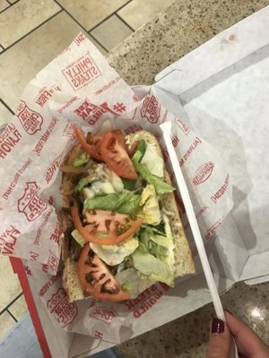 Small Philly cheesesteak. $7.49 before tax. Straw for scale