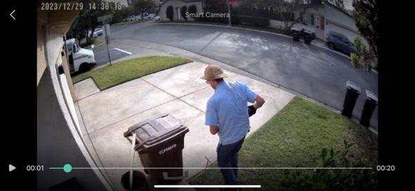 Postal carrier who just ruined a newly painted area by depositing a package in the center of it.