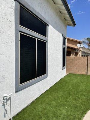 Window Sunscreens.   80% black fabric with Almond frame.