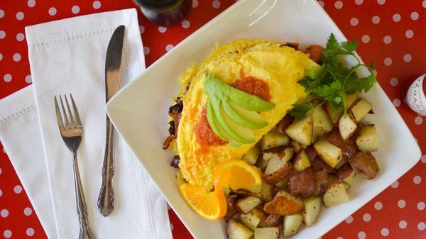 LOCOMOTIVE OMELET | BACON, SAUSAGE, LINGUICA, TOMATO, SOUR CREAM, CHEDDAR & PEPPER JACK CHEESE, SALSA, AND AVOCADO.