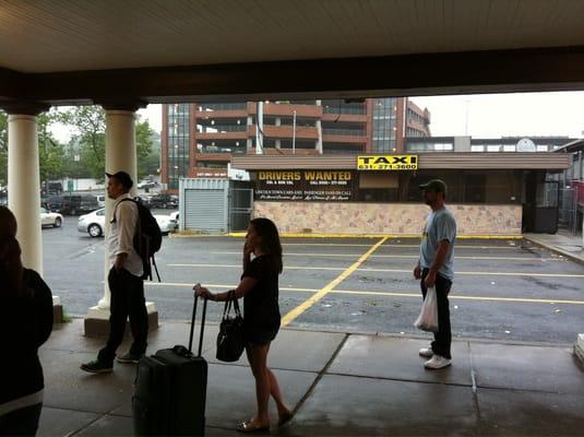 People waiting for taxis at Huntington Station