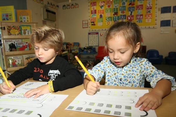 Working on our letters in library.