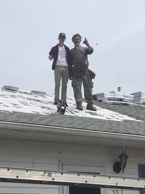 Rodney Hufford with his helper outing roof on addition.