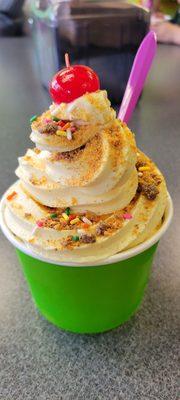 Cake batter frozen yogurt with butterfinger topping and rainbow sprinkles