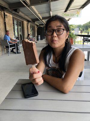 Sister with her banana Nutella popsicle dipped in milk chocolate!