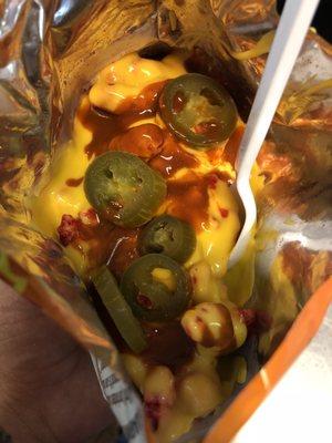 Hot Cheetos with cheese, jalapeños, and Valentina salsa