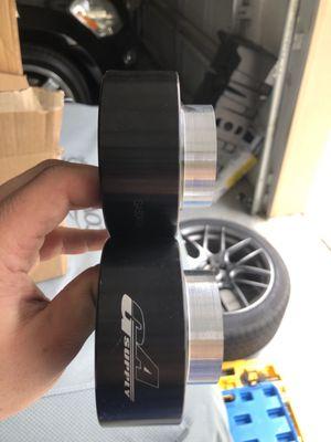 The two new machined spring spacers