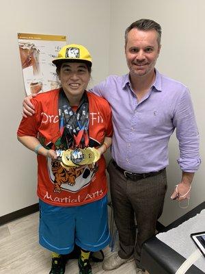 Kristina "Yes I CAN" Yeh with Dr. Chambers. My 17 martial arts medals I won for the 2021 season