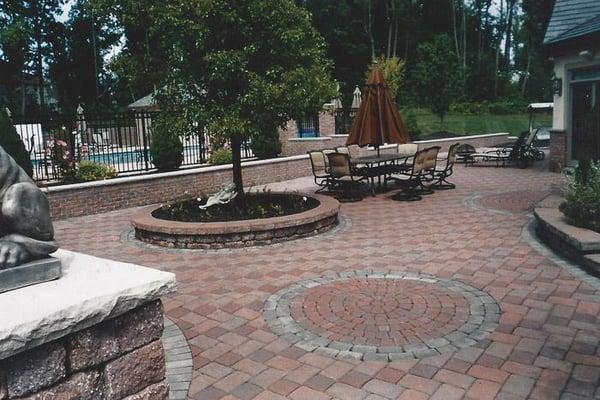 A mix of retaining walls, planter boxes and circle kits to turn this back yard into a private getaway for the homeowners to e...