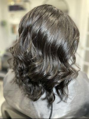 Brazilian blowout w/color refresh on naturally curly hair. Soft layered cut.