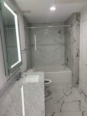 Mock-up Unit. Provided Cabinets, Counters, Vanity Tiles, Tub surround and LED Mirrors