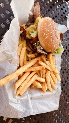 Med Rare Muddy Pepper Bacon Cheddar Cheese Burger and fries. Absolutely delicious!