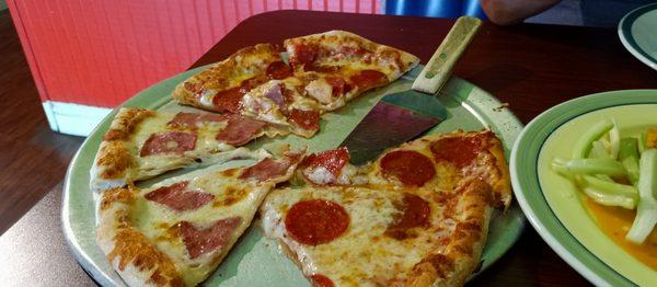 Pizza one side ham the other pepperoni and extra cheese we had to get a fork it was so hot we had to cut it.