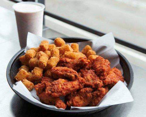 6-pack of bone-in wings in your choice of sauce, a basket side of your choice, and a sweet Hawaiian roll.