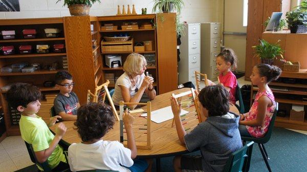 Lessons happen in the elementary classroom in small groups and one on one.