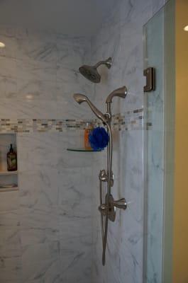 This is a custom shower, with a showerhead, and then a 2nd diverter which toggles between the main shower-head and a handheld...