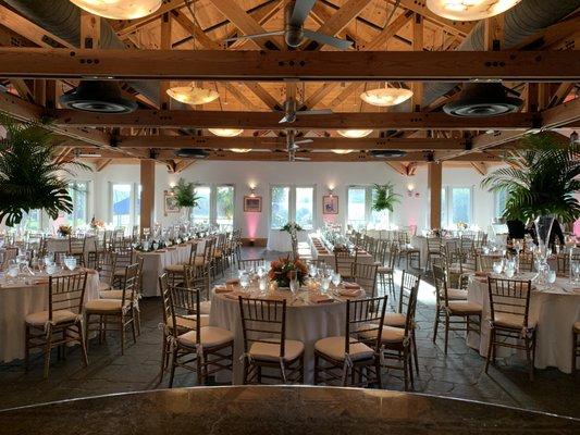 inside the restaurant set up for 150 people and a buffet with an inside bar and outside bar