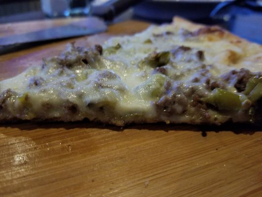 Absolutely delicious cheesesteak pizza. Check it out, -- it is packed with meat and cheese I put long hot on it and had it white! A WINNER !