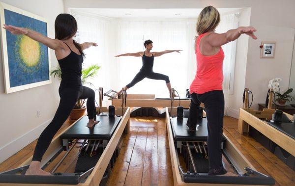 Small group classes on the Pilates Reformers at 8 Grand Ave