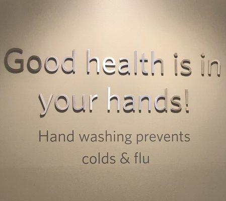 Signage above the hand washing station.