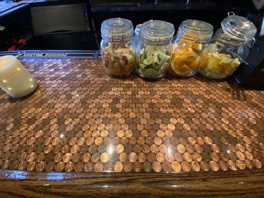 Bar counter top full of pennies