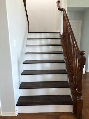 Engineer hardwood floor combine with white face per step.