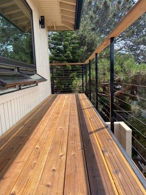 Balcony, redwood decking and cable railing