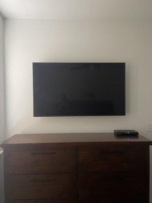 Mounted TV on wall in master bedroom. Added a power relocate and a cable pass through To hide the wires.