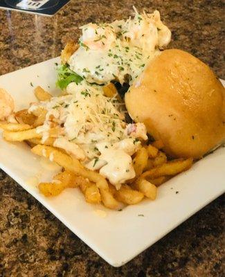 The Main Street Bistro (Cajun crab patty with seasoned shrimp lobster sauce fries, spring mix lettuce, old bay sauce on toasted sweet bun)