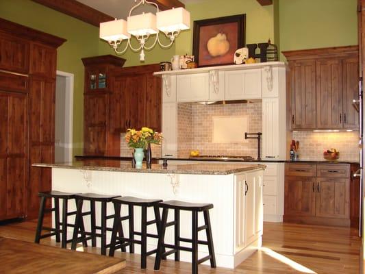 Custom designed kitchen featuring "green" cabinetry by Crystal.  Knotty Alder in a warm stain color and Knotty Alder painted.