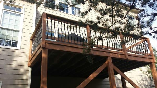 Stained deck and added metal pickets.