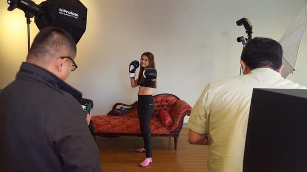 My  lovely friend Amanda showing off her guns in front of a luxury chair provided by the studio.