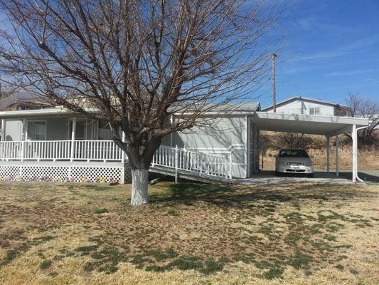 Remarks: Super nice 2 bedroom, 2 bath mobile with a Den on a double corner lot. Borders BLM land with great views from front ...