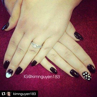 Black almond nails with heart designs