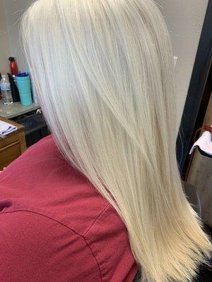 Tape in extensions with a root touch up on this icy blonde beauty