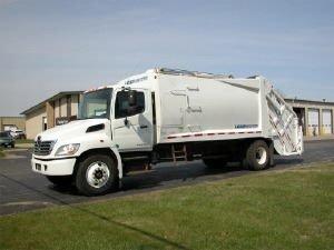 Our residential trash pick-up truck is a 2016 model Hino equipped with a Loadmaster compacting system.