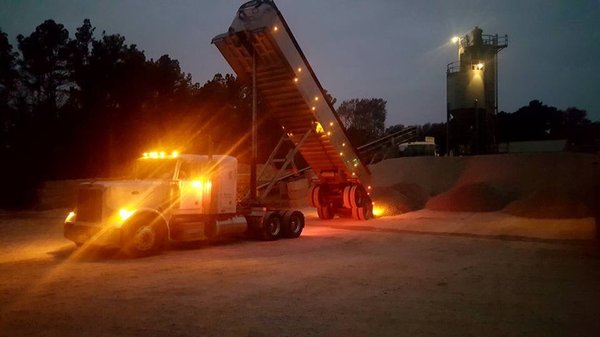 Truck #903 unloading 28 tons of 1 inch washed river rock at a Ready Mix Concrete Plant...