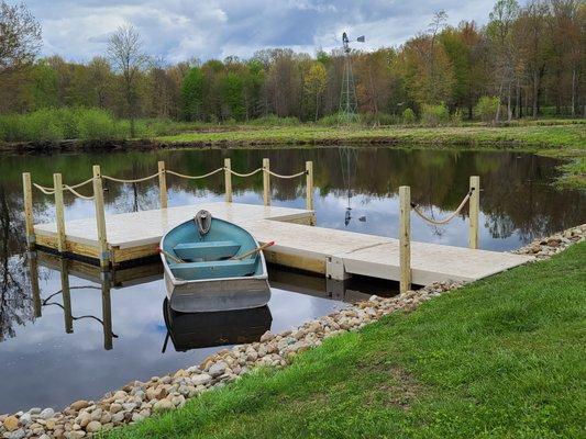 Custom Wave Armor Dock built with wood posts and sides for a wedding venue.