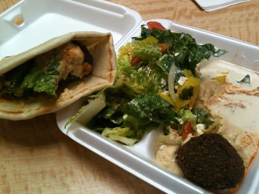 Falafel with hummus on pita bread with Greek salad