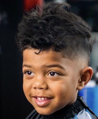 Barber:Carmen with a faux hawk mullet on a 3 year old.