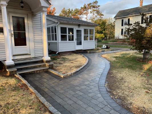 Pavers sidewalk with granite border.