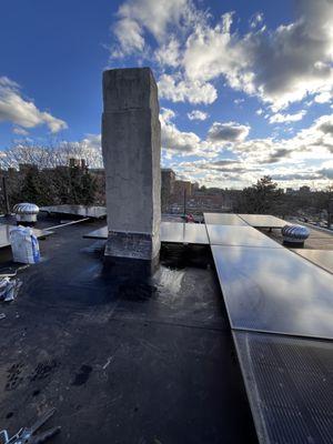 Chimney flashing on EPDM roof.