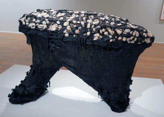 Nari Ward; Rolling Calf; 1993; tar, earth, salt, feathers, cotton, cloth, springs, ironing board