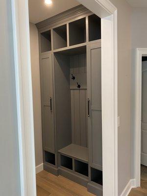 Custom built mud room seat and coat closets