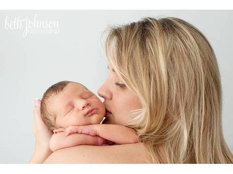 Newborn baby girl (6 days old) with her mom