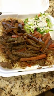 Large Pepper Steak with rice and peas and salad