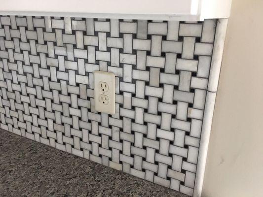 Marble "basketweave" backsplash.