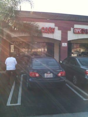 Front of building.That big tree is covering 90% of the business sign.