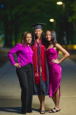 Celebrating academic achievement with family amidst the iconic beauty of the University of Maryland campus.