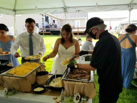 Wedding reception line at buffet